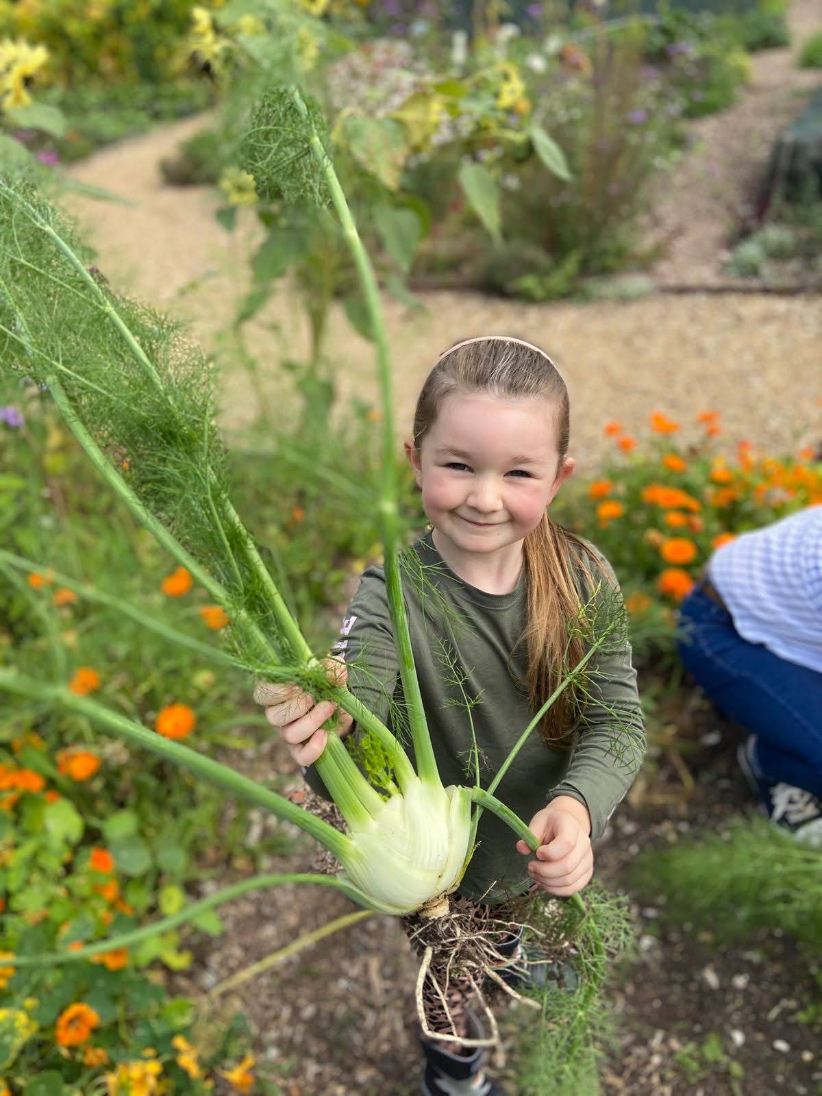 Potting-shed-club-girl-with-vegetable