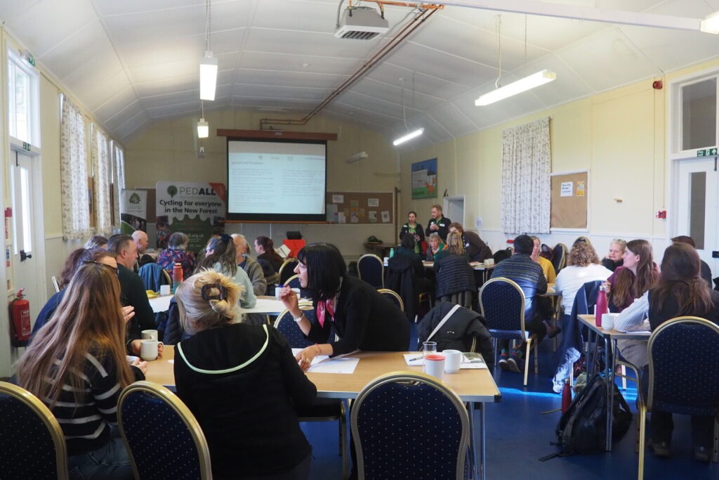 A room full of people take part in workshop discussions at the Green Health Hub's Connect and Learn event.